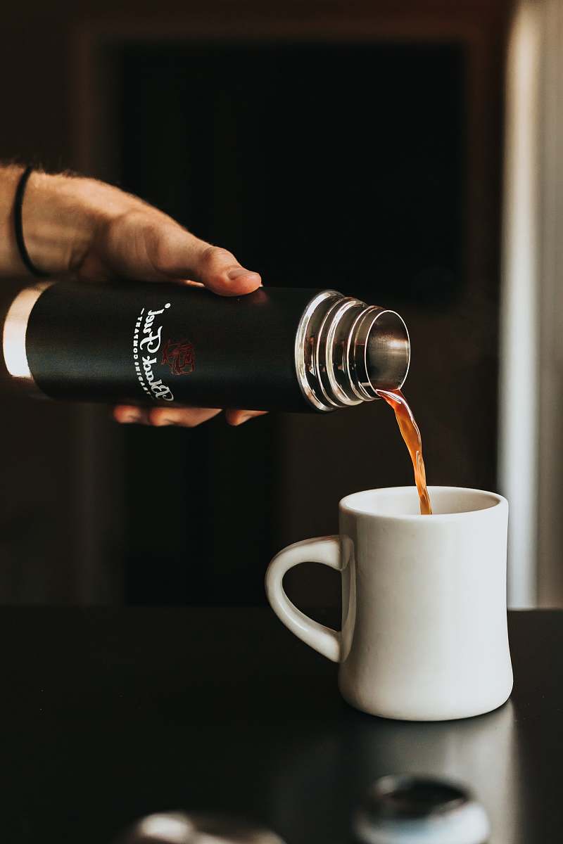 coffee cup person holding thermal carafe coffee